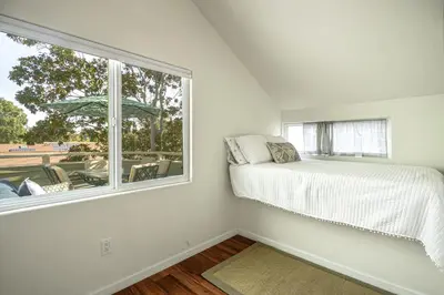 a bedroom with a bed and a window at Encinitas Paradise | Seabluffe Gated Community w/ Beach Access in Encinitas