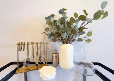 a vase with a plant in it on a table at 2 bed 2 bath penthouse condo with AC and Ocean Views in San Diego