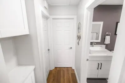 a bathroom with a white door and a sink at Gillespie Drive 1063 Unit B by sdstay in Spring Valley