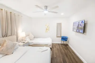 a bedroom with two beds and a ceiling fan at Gillespie Drive 1063 Unit B by sdstay in Spring Valley