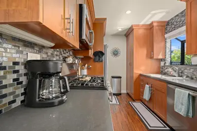 a kitchen with a coffee maker on the counter at Mission Hills Dream - BBQ, Patios, AC, Parking in San Diego