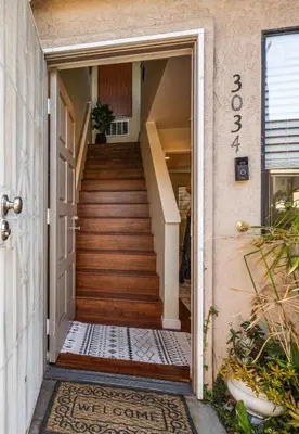 an open door to a house with a staircase at Mission Hills Dream - BBQ, Patios, AC, Parking in San Diego
