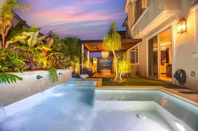 a swimming pool in the backyard of a house at # Marbella Lane - Stylish Dream Home in RMV with Pool in Mission Viejo