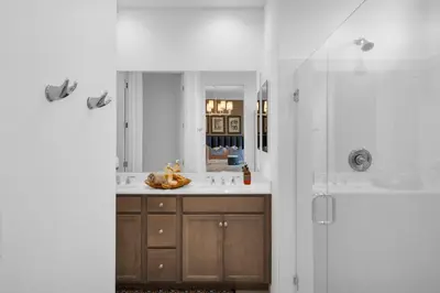 a bathroom with a sink and a shower at # Marbella Lane - Stylish Dream Home in RMV with Pool in Mission Viejo