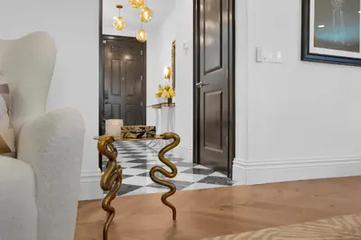 a living room with a snake statue on a floor at # Marbella Lane - Stylish Dream Home in RMV with Pool in Mission Viejo