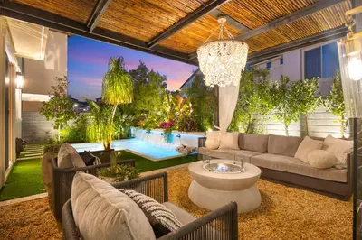 a living room with a couch and a table at # Marbella Lane - Stylish Dream Home in RMV with Pool in Mission Viejo