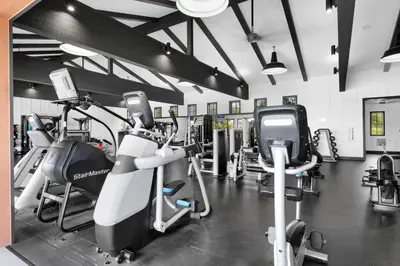 a gym with several treadmills and cardio machines at # Marbella Lane - Stylish Dream Home in RMV with Pool in Mission Viejo