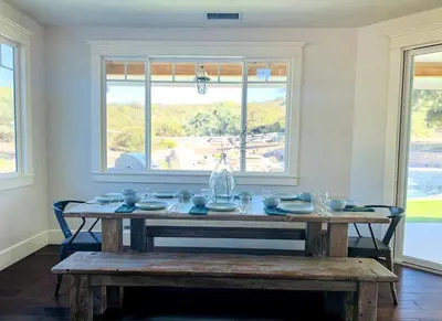 a dining room with a table with dishes on it at Getaway Retreat Close to Temecula San Diego LA in Murrieta