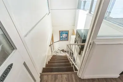 a staircase in a building with a window at Massive 5 bedroom overlooking the water-STR14-0105 in Dana Point