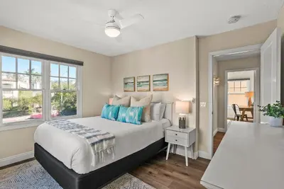 a bedroom with a large bed and a window at Lovely home with backyard oasis & great WiFi - walk to La Jolla Village, dogs OK in San Diego