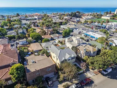 an aerial view of a small town with houses and the ocean at Lovely home with backyard oasis & great WiFi - walk to La Jolla Village, dogs OK in San Diego