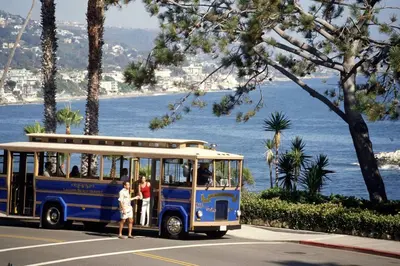 a blue bus parked on the side of a street at Laguna Beach House in Laguna Beach