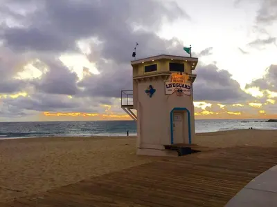 a lifeguard tower on the beach at sunset at Laguna Beach House in Laguna Beach