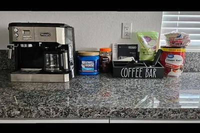 a counter top with a coffee maker and a coffee bar at Entire Private Home with 4 Bedrooms 2 Bathrooms, Mountain Edge, New House, Ranch, Gated Yard, Available Now in Menifee