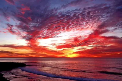 a sunset over the ocean with the sky at Tidal Wave 1 in San Diego