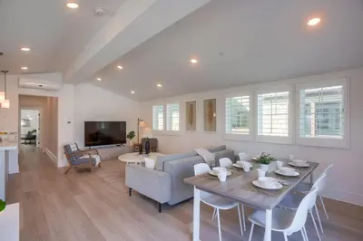 a living room with a table and a couch at Bayside Cove 8 in San Diego