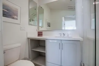 a white bathroom with a sink and a toilet at Bayside Cove 8 in San Diego