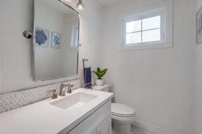 a white bathroom with a sink and a toilet at The Shores 7 in San Diego