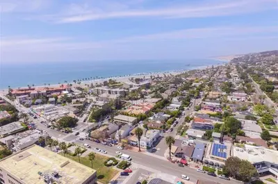 an aerial view of a city with the ocean at The Shores 7 in San Diego