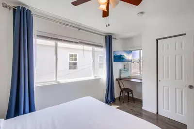 a bedroom with a bed and a window at Tidal Wave 2 WINTER SPECIAL! in San Diego