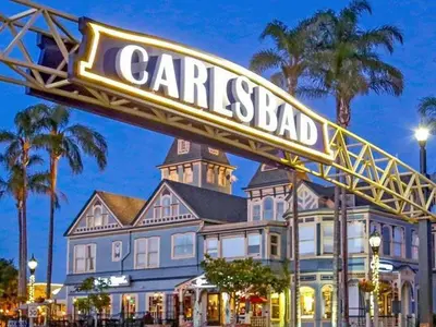 a sign that reads carriagesbad in front of a house at Terramar Point in Carlsbad