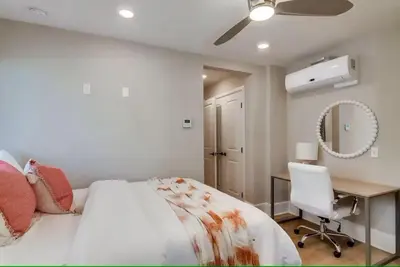 a bedroom with a bed and a desk and a chair at Bayside Cove 7 in San Diego