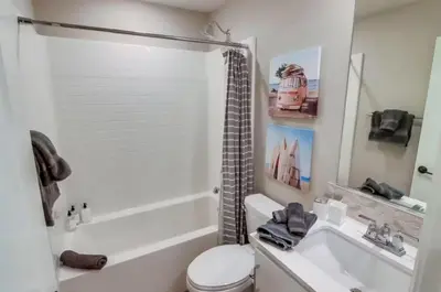 a bathroom with a toilet and a sink and a shower at Bayside Cove 7 in San Diego