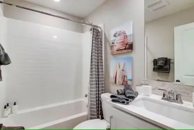 a bathroom with a sink and a toilet and a tub at Bayside Cove 7 in San Diego