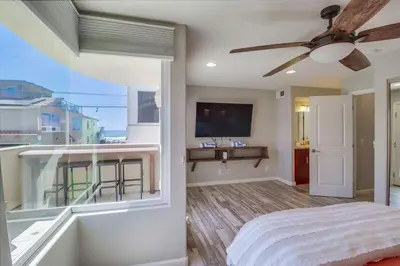 a bedroom with a bed and a large window at Ocean & Bay in San Diego