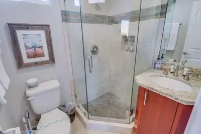 a bathroom with a shower and a toilet and a sink at Ocean & Bay in San Diego