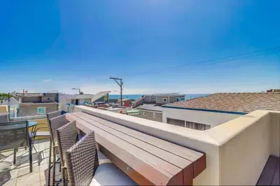 a balcony with chairs and a view of the ocean at Ocean & Bay in San Diego