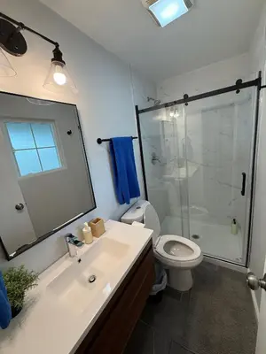 a bathroom with a sink and a shower and a toilet at Heated pool, Sunny San Diego, Entire home, Free Parking, BBQ, Pets allowed, family neighborhood! in San Diego