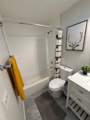 a bathroom with a toilet and a tub and a sink at Heated pool, Sunny San Diego, Entire home, Free Parking, BBQ, Pets allowed, family neighborhood! in San Diego