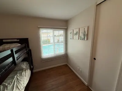 a bedroom with a bunk bed and a window at Heated pool, Sunny San Diego, Entire home, Free Parking, BBQ, Pets allowed, family neighborhood! in San Diego