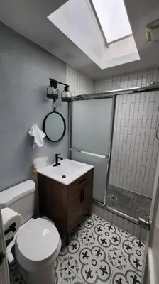 a bathroom with a toilet and a shower and a sink at 4Bedrooms Home Laundry Parking Walk to SDSU in San Diego