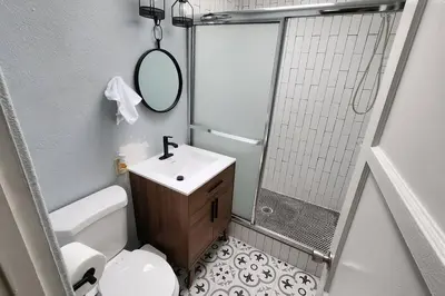 a bathroom with a toilet and a sink and a shower at 4Bedrooms Home Laundry Parking Walk to SDSU in San Diego