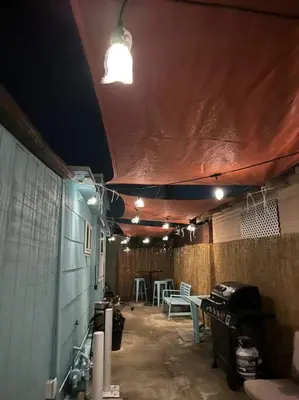 a garage with a room with a table and chairs at Comfy Cottage Near the Beach in San Diego