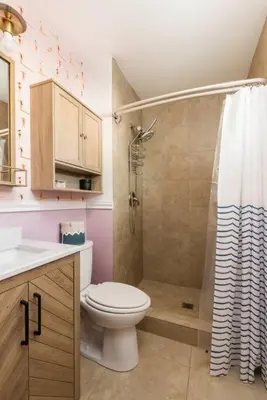 a bathroom with a toilet and a shower at Leucadia Beach House - 4 Mins to Moonlight! in Encinitas