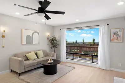 a living room with a couch and a window at Stylish & Bright 5 Star Location Ocean View Queen Beds in San Diego