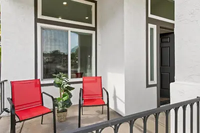 two red chairs on a porch with a plant at Good Vibes Cottage - Carlsbad-Vista-San Diego-Beach-Legoland in Vista
