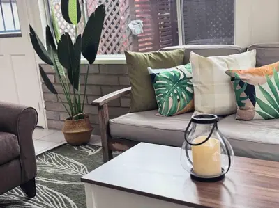 a living room with a vase on a table at Sunny Retreat HUGE Single Level Home with large yard in San Diego