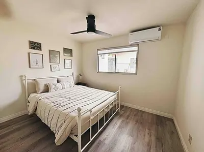 a bedroom with a bed and a ceiling fan at Sunny Retreat HUGE Single Level Home with large yard in San Diego