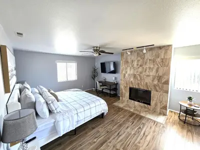 a bedroom with a bed and a fireplace at San Diego Fun-Gameroom & Gazebo-Centrally Located! in San Diego