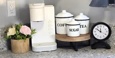 a counter with a coffee tea system and a clock at San Diego Fun-Gameroom & Gazebo-Centrally Located! in San Diego