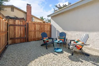 a patio with two chairs and a table and a fence at Urban Oasis - Just Remodeled in San Diego