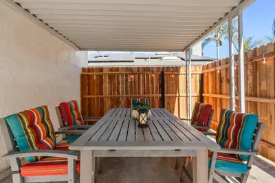a wooden table with chairs and a vase on it at Urban Oasis - Just Remodeled in San Diego