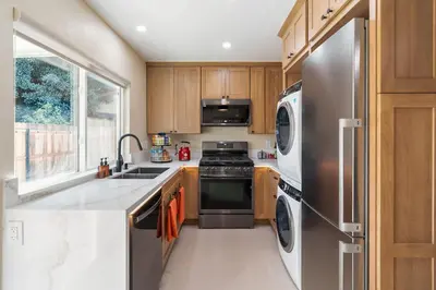 a kitchen with a stainless steel refrigerator and a dishwasher at Urban Oasis - Just Remodeled in San Diego