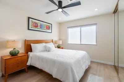 a bedroom with a bed and a ceiling fan at Urban Oasis - Just Remodeled in San Diego