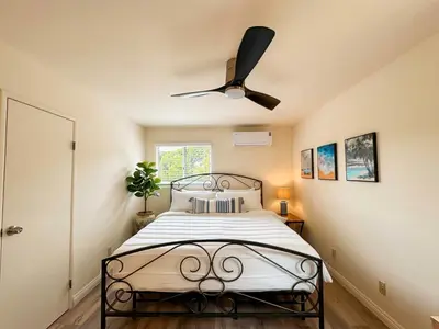 a bedroom with a bed with a ceiling fan at Pet friendly Spacious 3Bed with HUGE Back Yard in San Diego