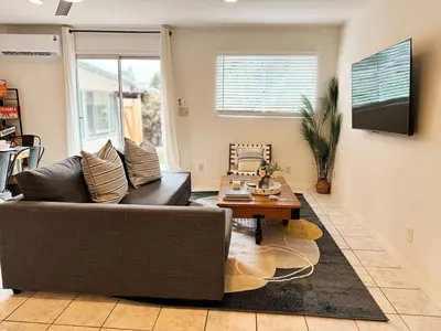 a living room with a couch and a table at Pet friendly Spacious 3Bed with HUGE Back Yard in San Diego